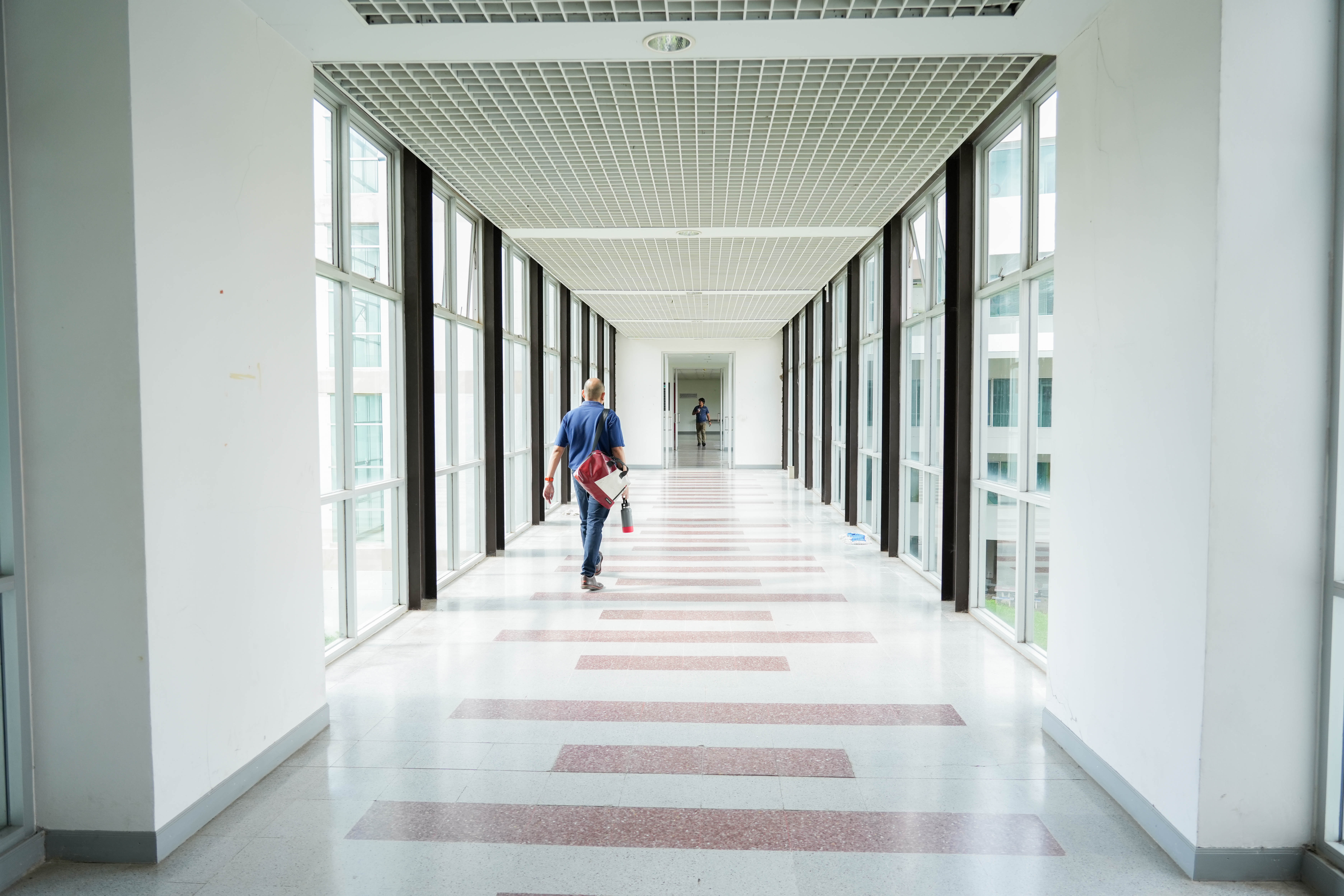 Naturally lit corridor with large windows, University of Phayao