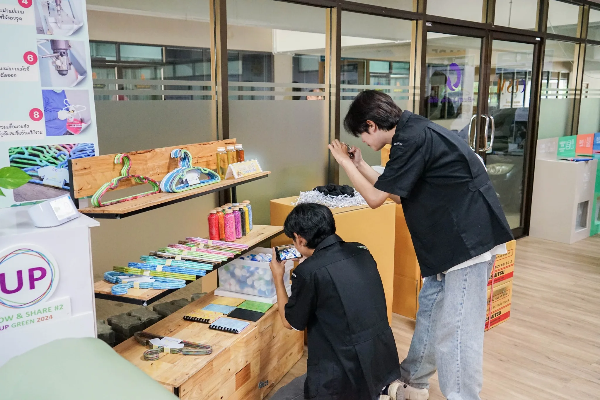 Staff presenting circular economy and sustainable resource use exhibits