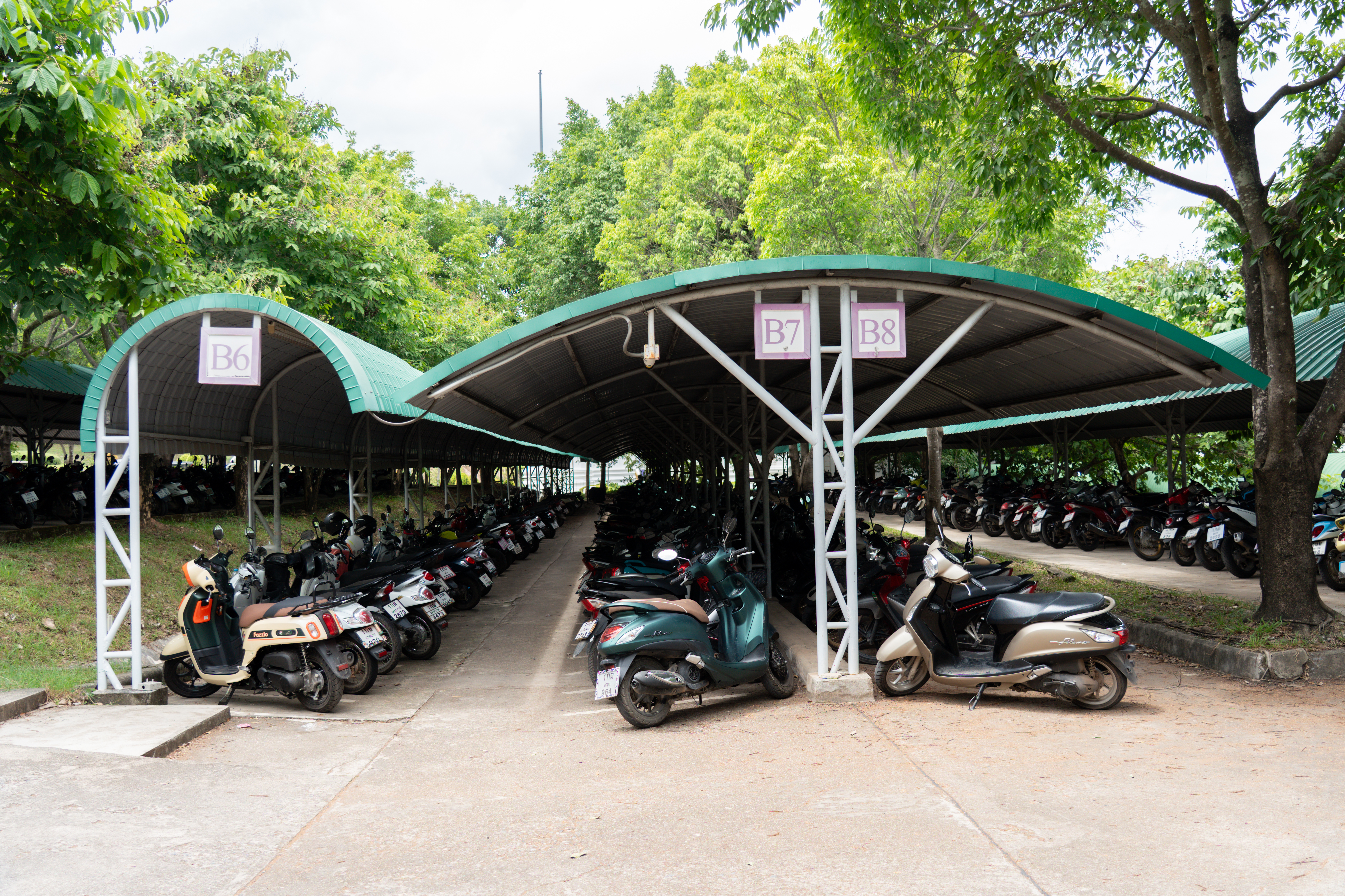 Motorcycle parking area with security post, University of Phayao