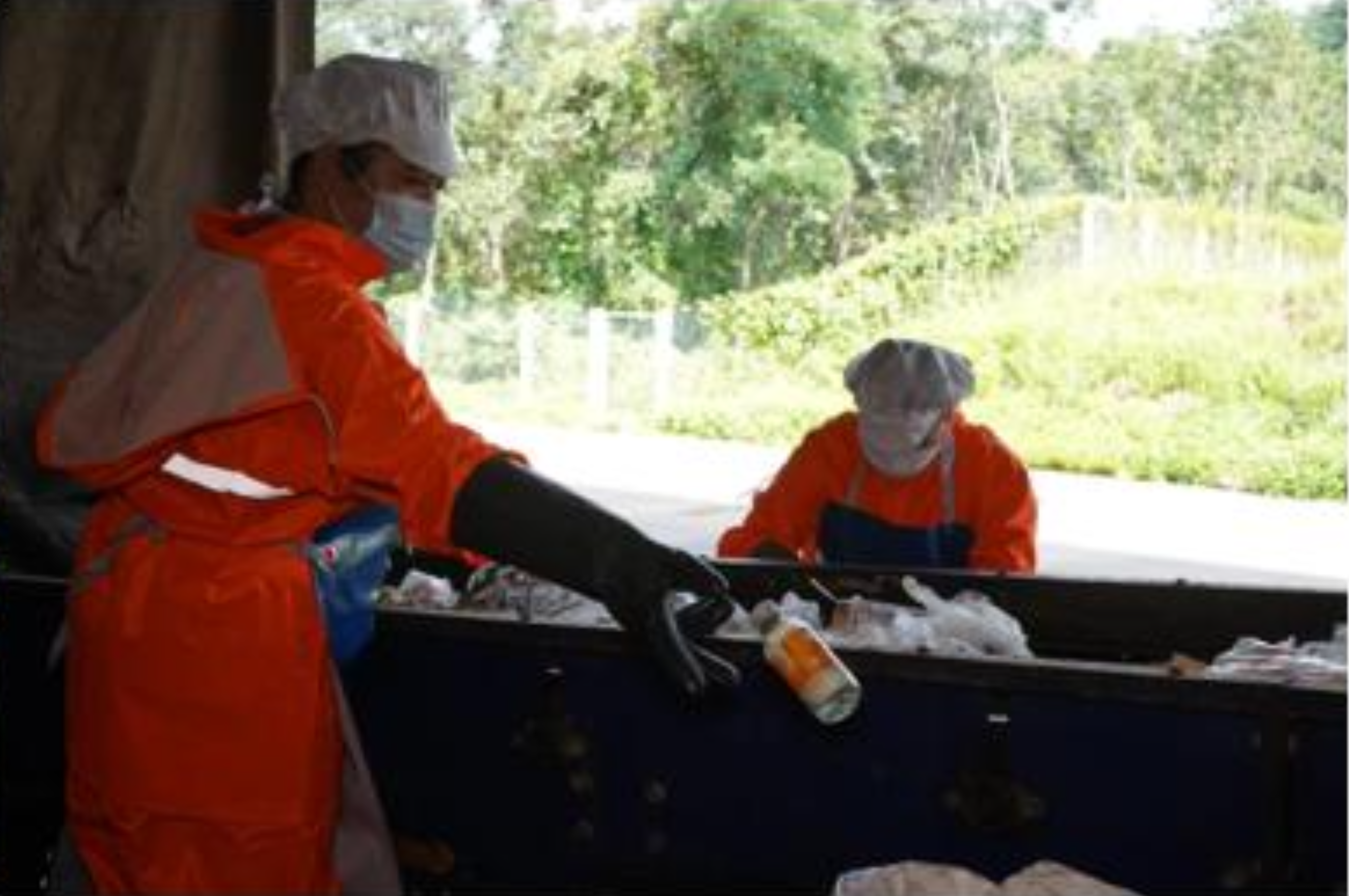 Worker sorting recyclable materials