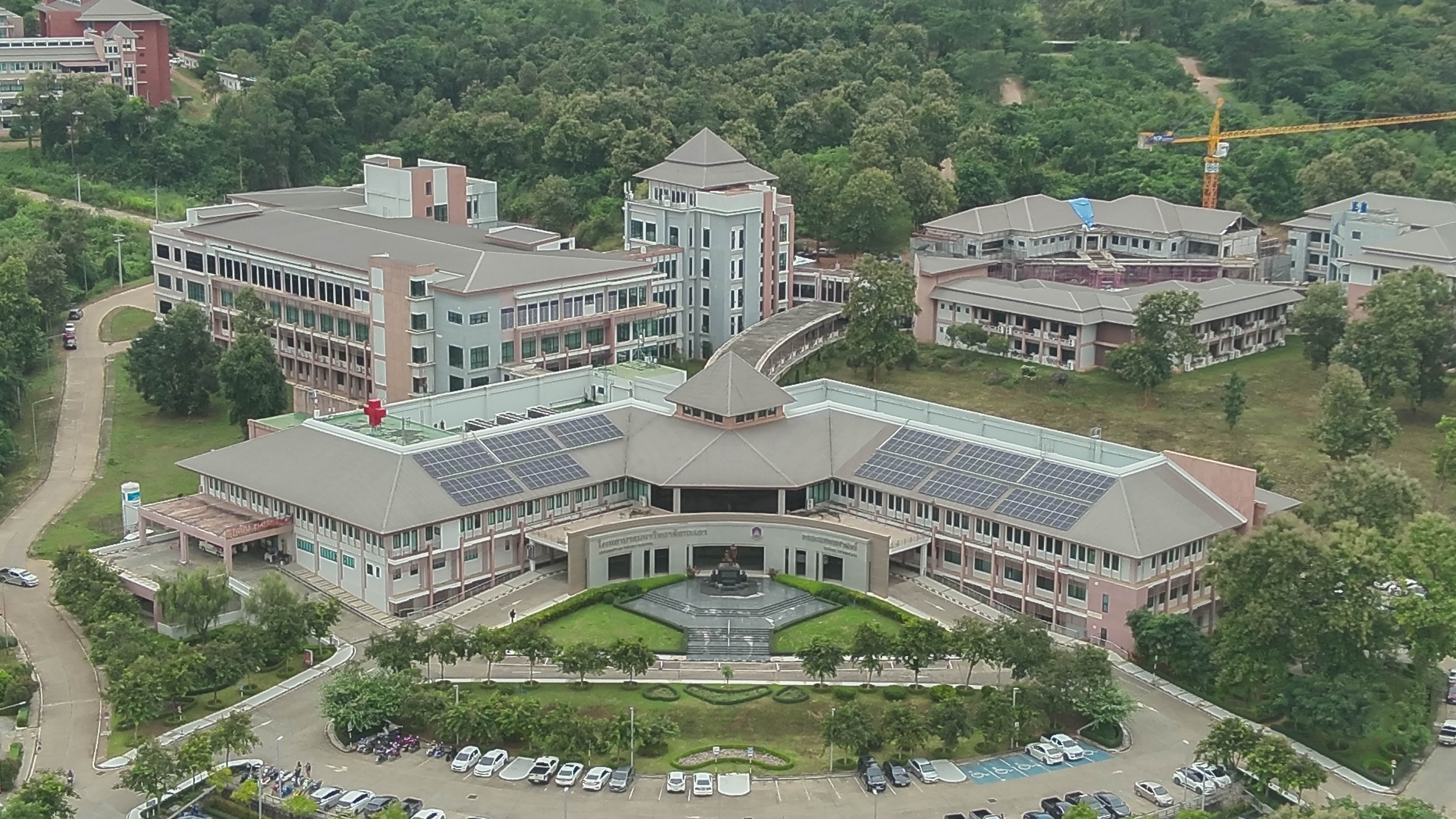 Aerial view of dome building with solar panels